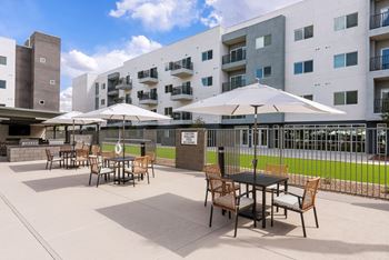 Al fresco kitchen with grilling stations and lounge seating